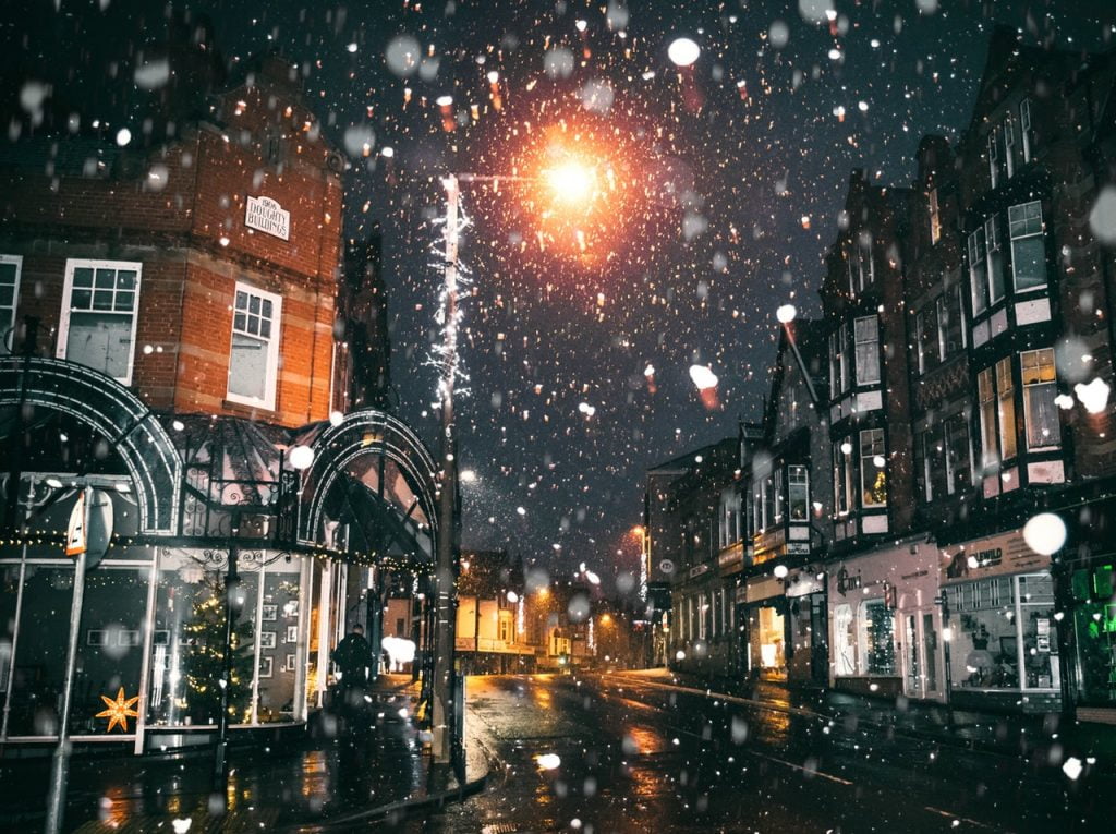 a street with buildings and lights