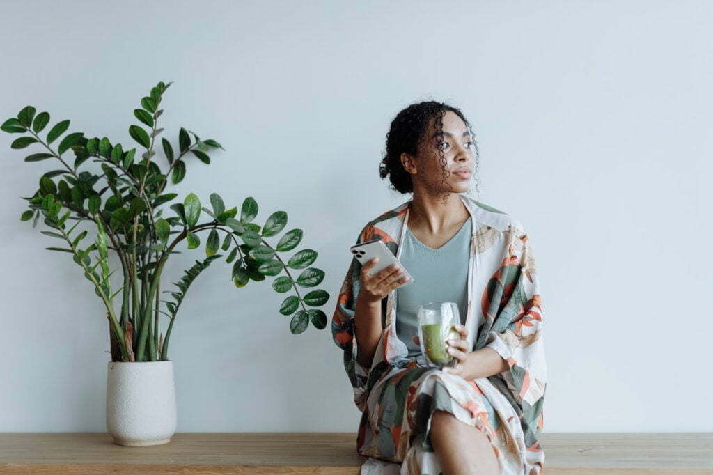 a person holding a glass of water