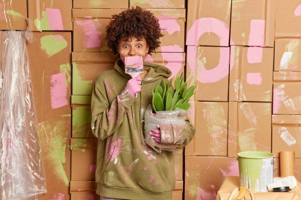 a person holding a plant