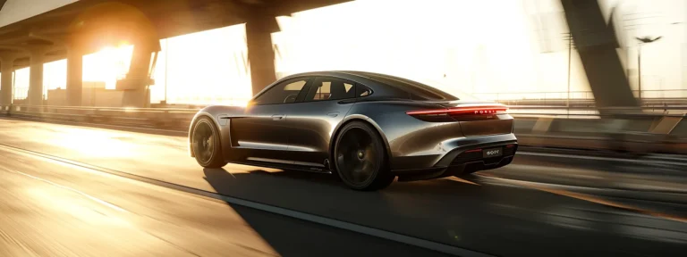 a sleek, electric car speeding down a sunlit highway.